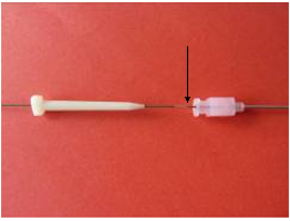 Wire with arrow pointing to mark that indicates adequate level of insertion.