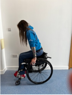 Patient rising form chair side view