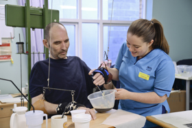 Patient and therapist hand therapy